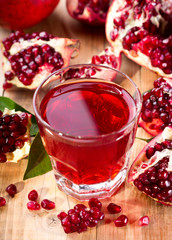glass of pomegranate  juice with fresh fruits