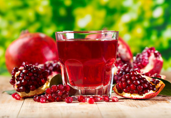 glass of pomegranate  juice with fresh fruits