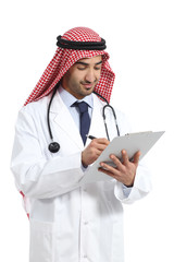 Arab saudi doctor man working writing in a clinical history