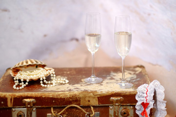 Two champagne glasses and pearls