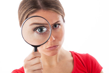 Girl using magnifying glass