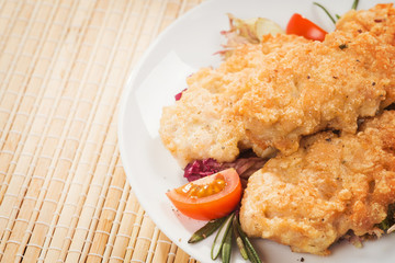Fresh chicken cutlets with vegetables. Background