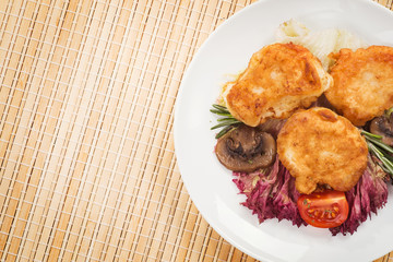 Fish in batter with fried mushrooms. Background