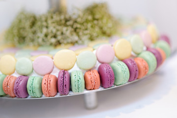 Traditional macarons on a glass cake stand