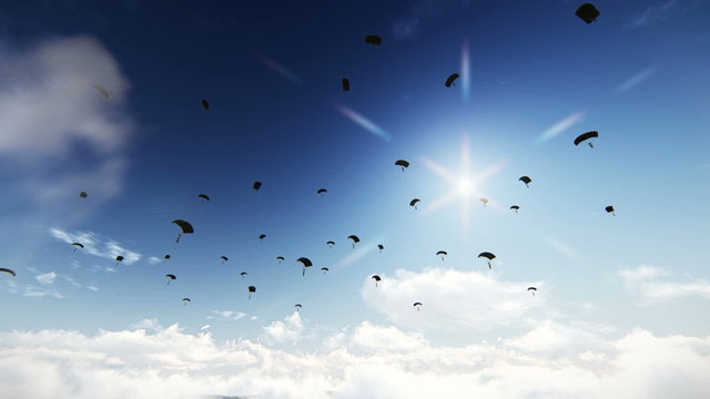 Flying across multiple paratroopers descending from the sky