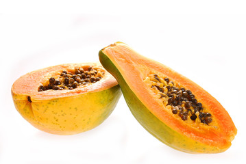 two halves of fresh papaya isolated on white