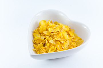 A bowl of nutritious and delicious corn flake cereal with milk