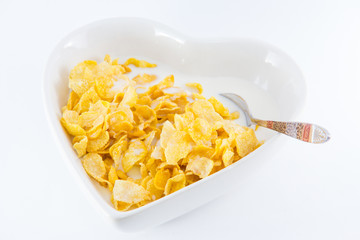 A bowl of nutritious and delicious corn flake cereal with milk