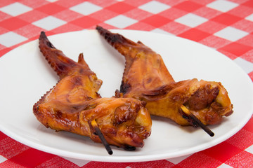 grilled chicken wings on white plate