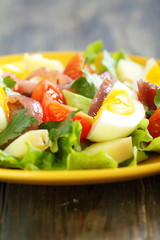 Salad and potatoes, egg and anchovies.