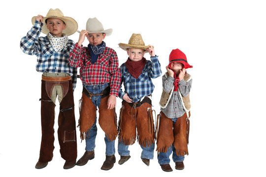 four young cowboys being silly and having fun posing
