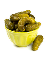 pickled cucumbers in a green bowl