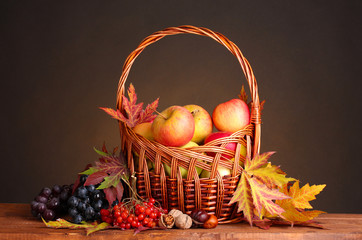 beautiful autumn harvest in basket and leaves