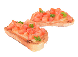 Delicious bruschetta with tomatoes isolated on white