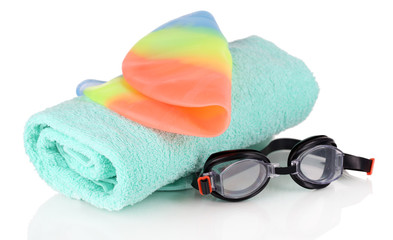 Set for pool: swim cap, goggles and towel isolated on white