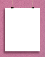 paper card on a pink wall.