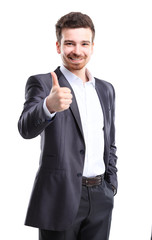 Happy smiling young business man with thumbs up gesture