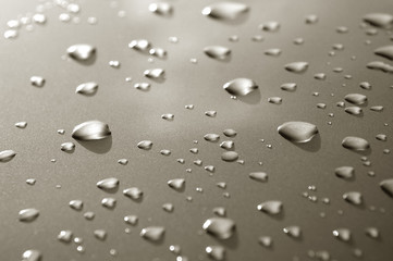 raindrops on a luxury metallic vehicle panel