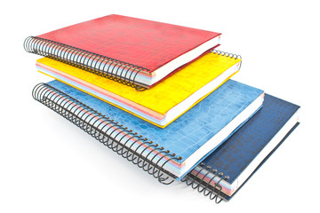 Stack of colorful spiral notebooks isolated on white