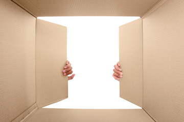 hand open cardboard box