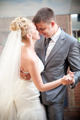 Closeup portrait of bride and groom dancing waltz