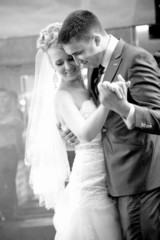 bride and groom dancing waltz during wedding ceremony