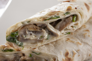 Savoury pancake with creamy mushroom and spinach filling.