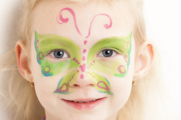 portrait of little girl with face painting