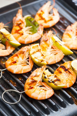 prawn skewers with lime on electric grill