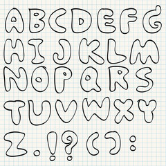 Hand drawn alphabet on line paper