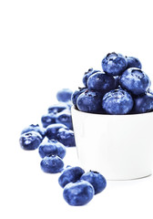 Blueberries in a bowl isolated on white background close up. Bil