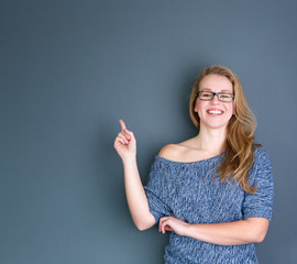 Young woman laughing and pointing finger