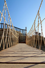Obraz premium Rope bridge made of wooden planks
