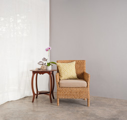 Rattan sofa chair in lounge setting