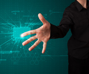 Businessman pressing high tech type of modern buttons