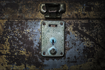 Old rusty shutter lock keyhole extreme closeup