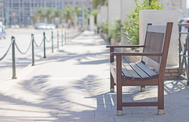 Empty bench in the city center.
