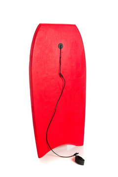 Red boogie board on white