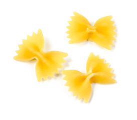 uncooked macaroni, farfalle on a white background