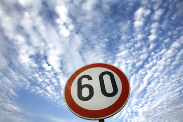 road sing speed limit on sixty
