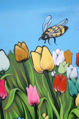 Fototapeta na wymiar Tulips and bee,Street art