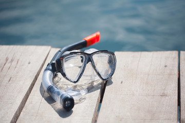 snorkel equipment in front of water