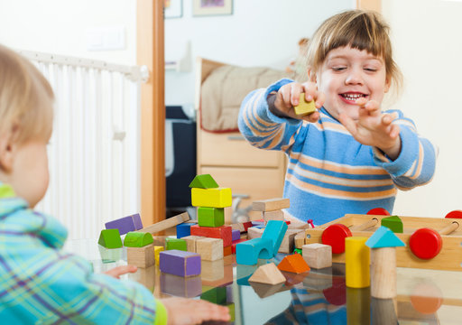  Children Playing With Wooden Blocks