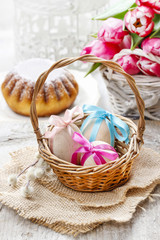 Fototapeta na wymiar Easter eggs in wicker basket