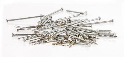 Group of nail and screws lay on white background