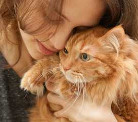  portrait of beautiful young woman 20 years with a fluffy red ca