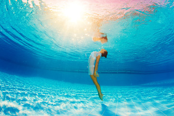 underwater swimming and reflection in water