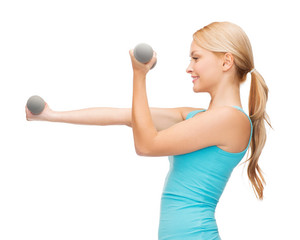 young sporty woman with light dumbbells