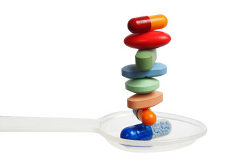 Stack of pills on a spoon