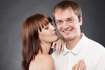 Сlose-up  portrait of beautiful loving couple posing in a studi